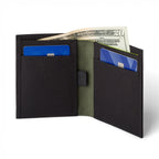 Black COR bifold wallet open to show card pockets and the green-lined cash sleeve; pictured cards and cash are not included.
