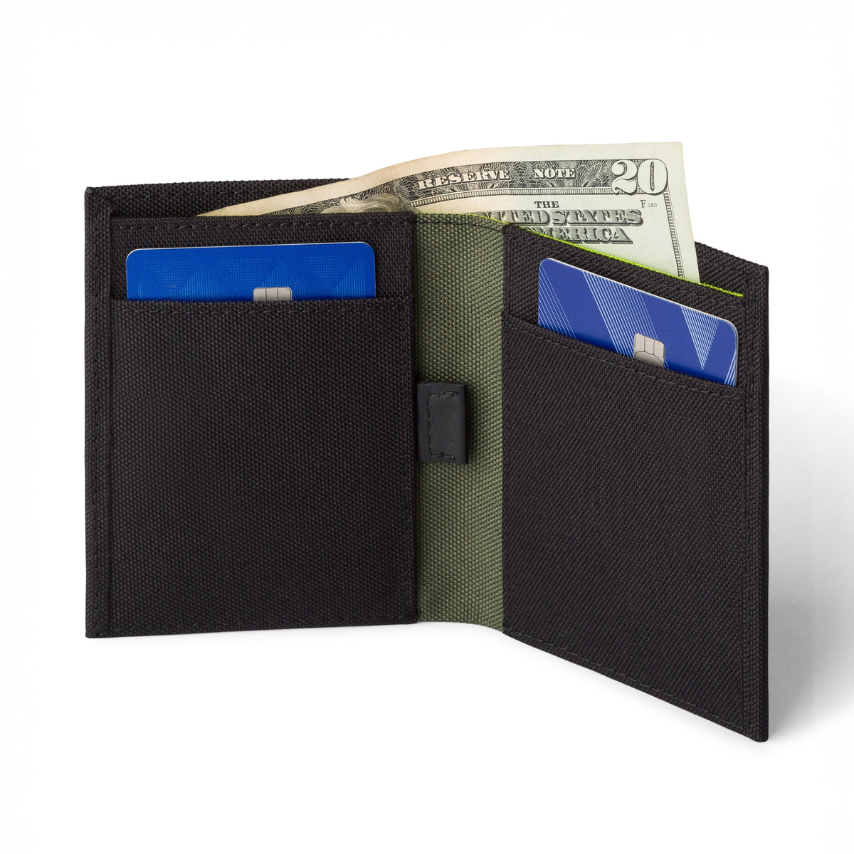 Black COR bifold wallet open to show card pockets and the green-lined cash sleeve; pictured cards and cash are not included.